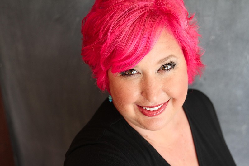 Ooltewah artist Kerry Anne Finley, 43, has a son who loves her fuchsia hair and a husband who learned to love it quickly. When Finley met a Muslim woman wearing a hijab (scarf) the same brilliant pink as Finley's hair, the two shared a delighted laugh over the matching tastes.