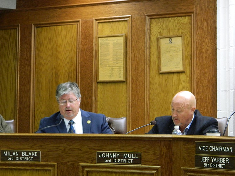 Bradley County commissioners Milan Blake, left, and Johnny Mull, discuss concerns regarding state funding of local school districts.