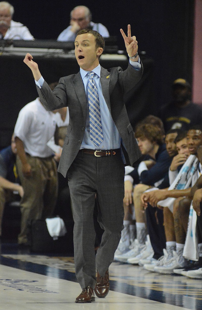 UTC coach Matt McCall instructs from the sideline as the University of Tennessee at Chattanooga hosts Hiwassee College in a men's basketball game Monday, Nov. 16, 2015, in Chattanooga, Tenn. UTC won their home opener by a score of 94-55.