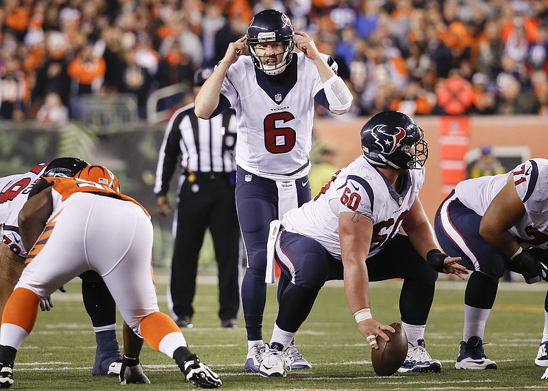 Houston Texans quarterback T.J. Yates (6) signals to his players at the line of scrimmage in the second half of an NFL football game against the Cincinnati Bengals in Cincinnati on Monday, Nov. 16, 2015.
