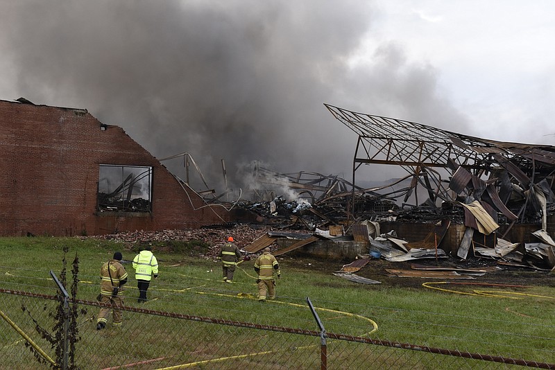 Firefighters worked for days after the idled Barwick Mills caught fire Saturday. EPA officials are concerned about water runoff and air as the fire still smolders.