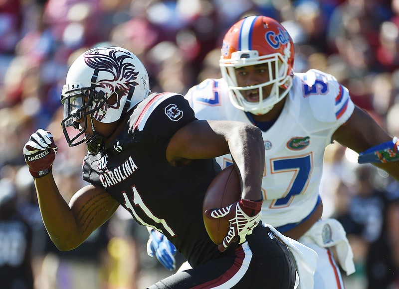 South Carolina junior receiver Pharoh Cooper threw for a touchdown and caught a touchdown last Saturday against Florida, but it wasn't enough in a 24-14 loss that left the Gamecocks 3-7 with two games remaining.