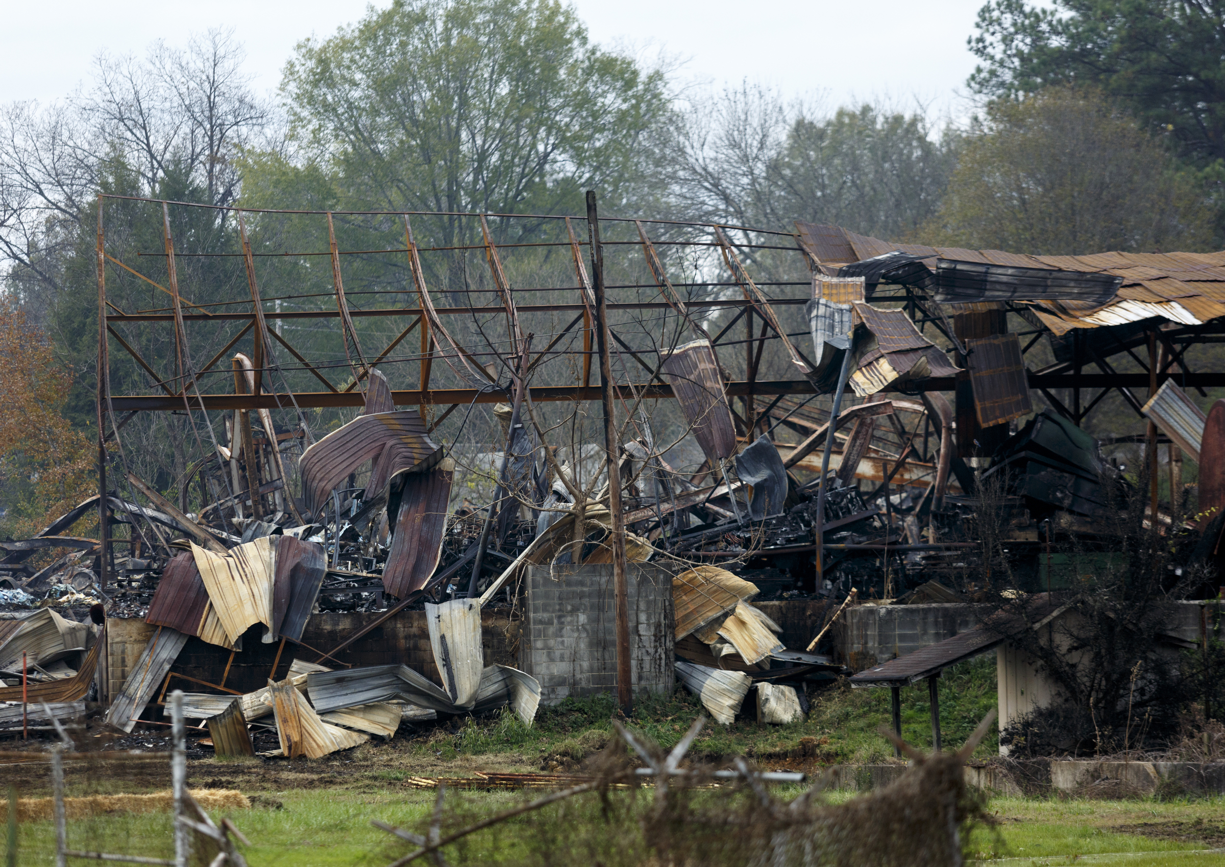 The burned wreckage of the Barwick Mills building is seen on Tuesday, Nov. 17, 2015, three days after a fire destroyed much of the building in Lafayette, Ga. The EPA has been taking air samples to assess the impact of the fire.