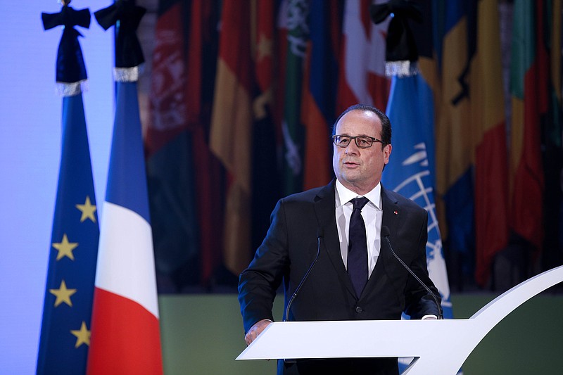 
              French President Francois Hollande delivers a speech for the 70th General Conference of the United Nations Educational, Scientific and Cultural Organization (UNESCO) at the UNESCO headquarters in Paris, Tuesday, Nov. 17 2015. France earlier invoked a never-before-used European Union "mutual-defense clause" to demand Tuesday that its partners provide support for its operations against the Islamic State group in Syria and Iraq and other security missions in the wake of the Paris attacks. (Yoan Valat, Pool photo via AP)
            