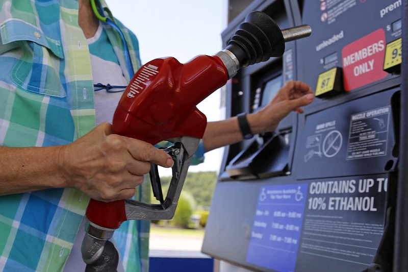 
              FILE - In this July 16, 2015, photo, a customer refuels her car at a Costco in Pittsburgh.  U.S. consumer prices rose modestly in October, 2015 as low gasoline costs and a strong dollar have suppressed inflation. The Labor Department says the consumer price index rose 0.2 percent last month after falling in September and August. Gas costs increased 0.4 percent in October but have plunged 27.8 percent over the past 12 months. (AP Photo/Gene J. Puskar)
            