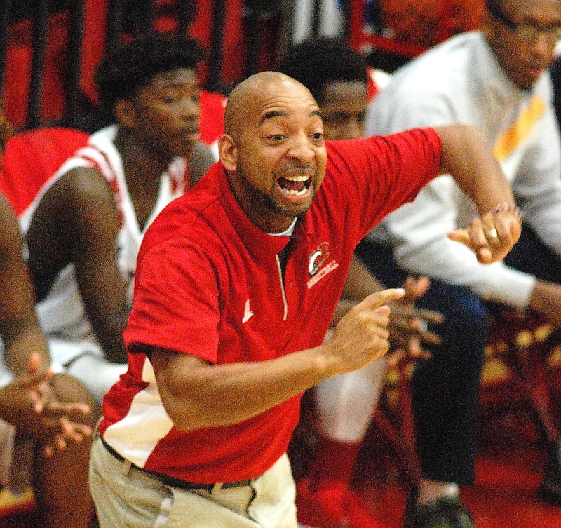 Ooltewah head coach Tank Montgomery directs his team. The Arts & Sciences Patriots visited the Ooltewah Owls in early season TSSAA Basketball action on Tuesday, Nov.17, 2015.
