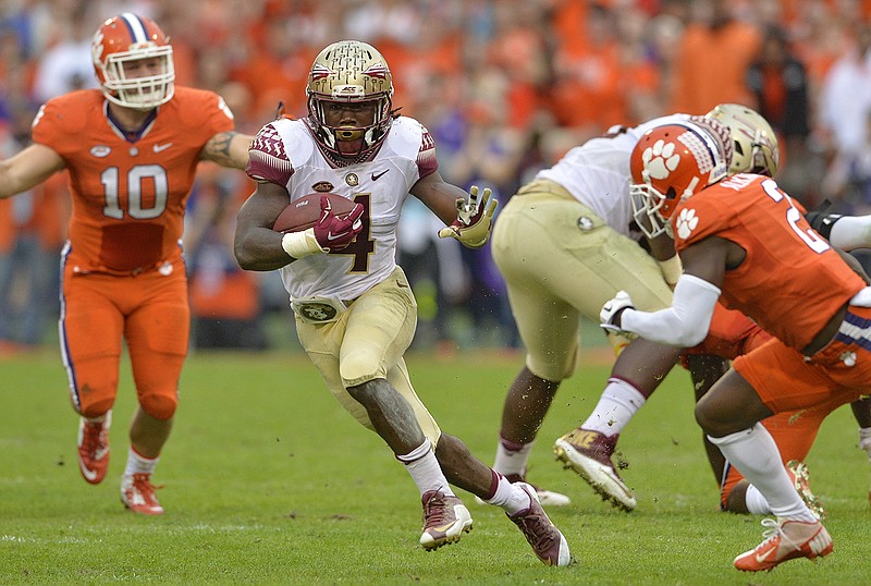 Florida State running back Dalvin Cook picks up a first down during the Seminoles' game at Clemson on Nov. 7. Cook, a sophomore, has 1,369 yards on 170 carries this season, as well as 15 total touchdowns.