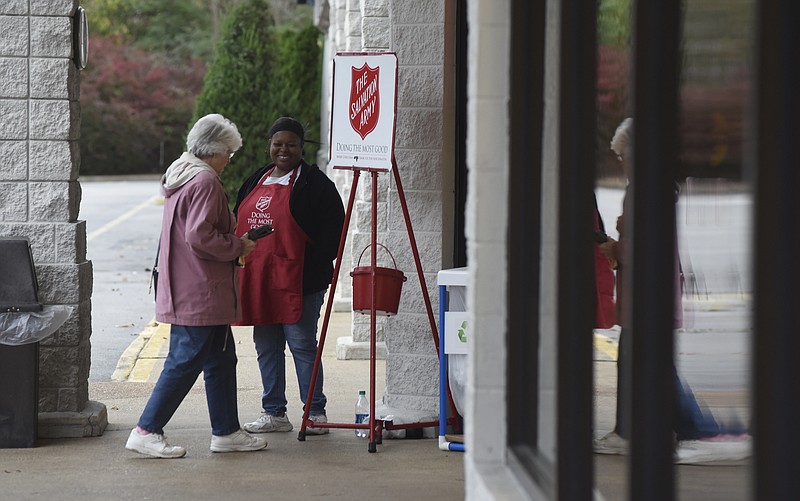 Patricia Rivers rings a bell as she collects donations at the Salvation Army kettle in front of the Food City grocery store in the St. Elmo community on Wednesday, Nov. 18, 2015, in Chattanooga, Tenn.