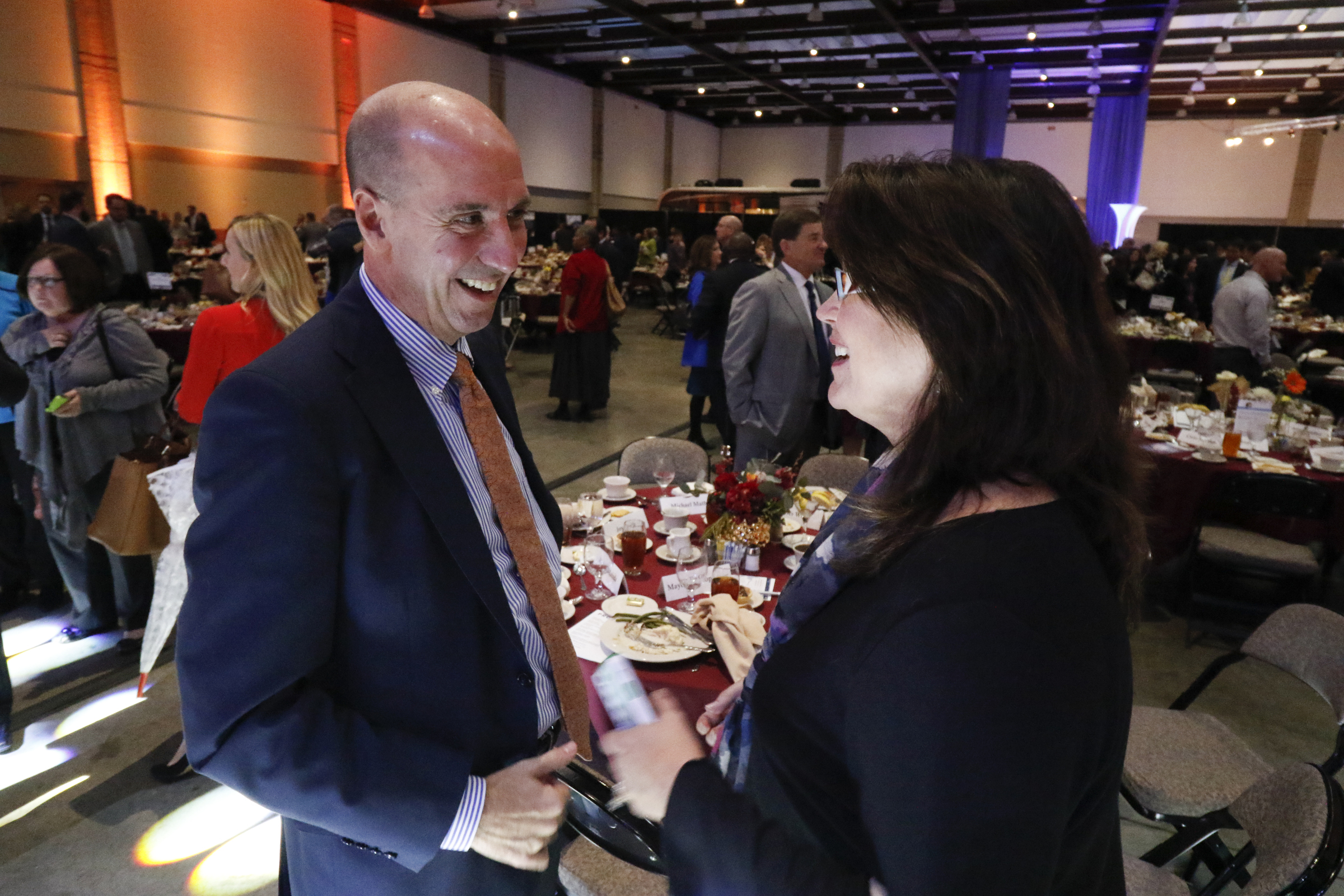 Keynote speaker Jack Uldrich speaks to Executive Director of Chatech Ronna-Renee Jackson at the conclusion of the Spirit of Innovation awards luncheon in the Chattanooga Convention Center on Nov. 18, 2015.