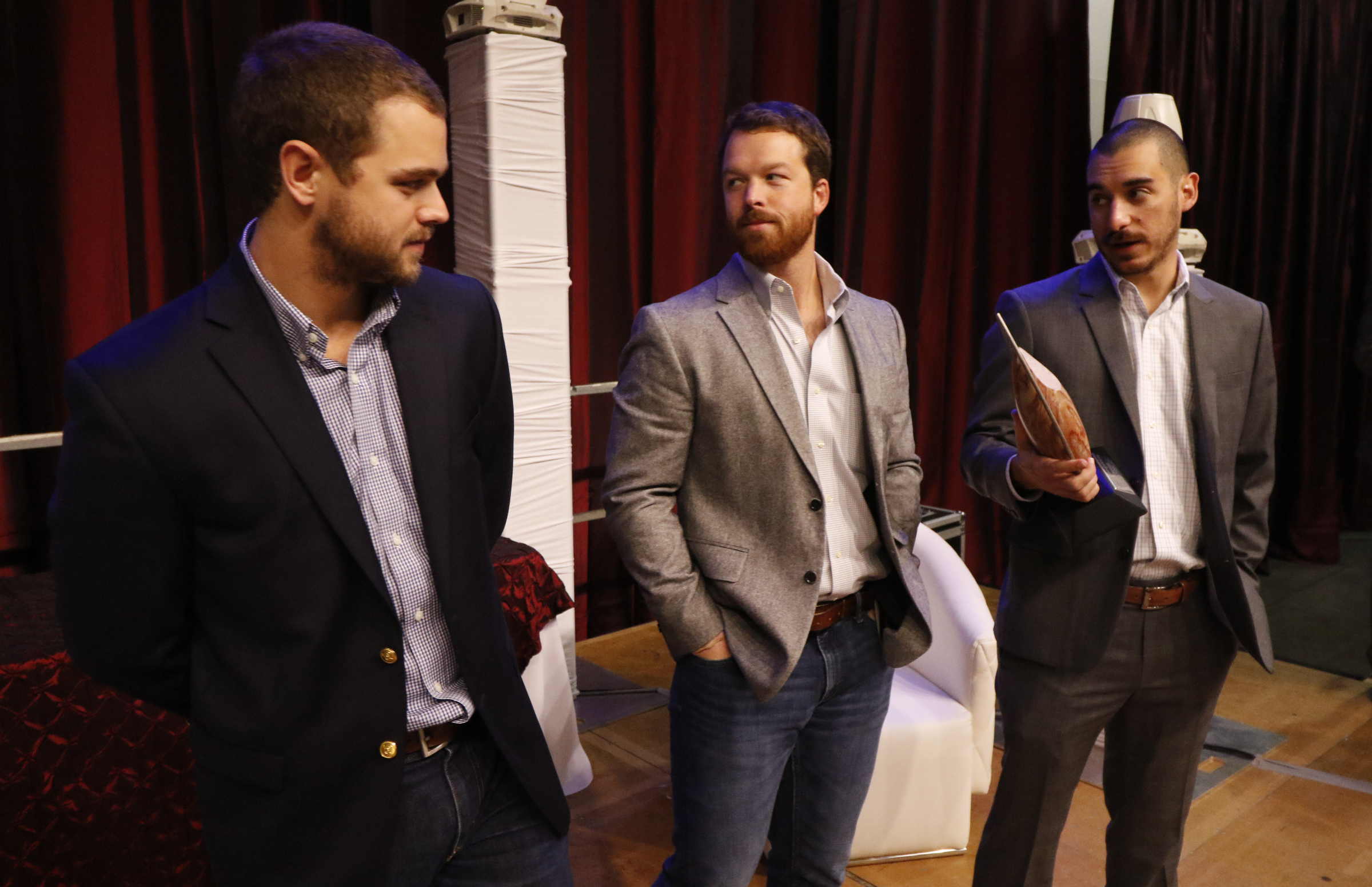 Jared Houghton, Brian Trautschold and Travis Truett with Ambition accept the 2016 Spirit of Innovation award in the Chattanooga Convention Center on Nov. 18, 2015.
