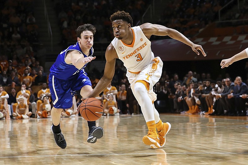 Tennesse guard Robert Hubbs dribbles toward the basket during the Volunteers' season-opening win against UNC Asheville on Friday in Knoxville. Hubbs suffered a severe cramp during the game that initially appeared to spectators to be a much more serious injury.