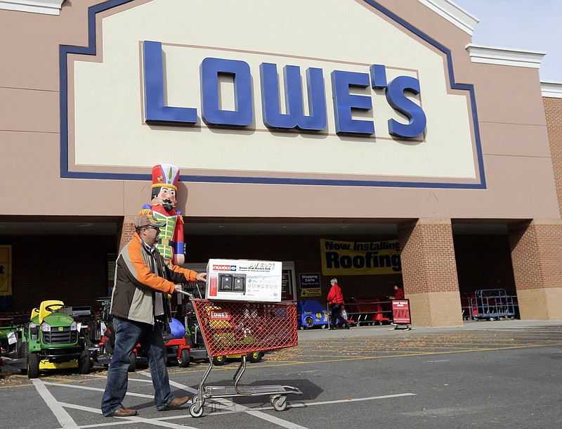 
              FILE - In this Tuesday, Nov. 18, 2014, file photo, a customer leaves a Lowe's home improvement store in Matthews, N.C. Lowe’s reported Wednesday, Nov. 18, 2015, that the company's third-quarter results beat analysts’ estimates as its sales grew, buoyed by the ongoing housing market recovery. (AP Photo/Chuck Burton)
            