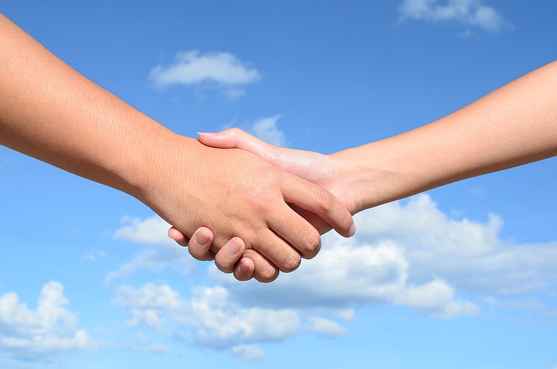 Hand shake between a man and woman