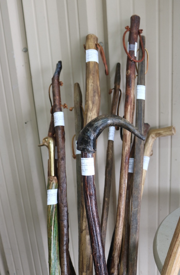 Handmade wooden walking sticks sell for $13 each.