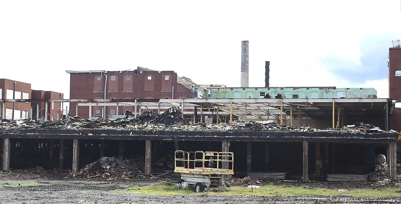 A building is demolished at Crystal Springs Print Works in Chickamauga on Wednesday, October 28, 2015.