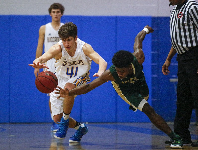 Boyd-Buchanan's Max Walker, left, and Notre Dame's Davian Wheeler scramble for a loose ball during their prep basketball game at Boyd-Buchanan High School on Thursday, Nov. 19, 2015, in Chattanooga, Tenn.