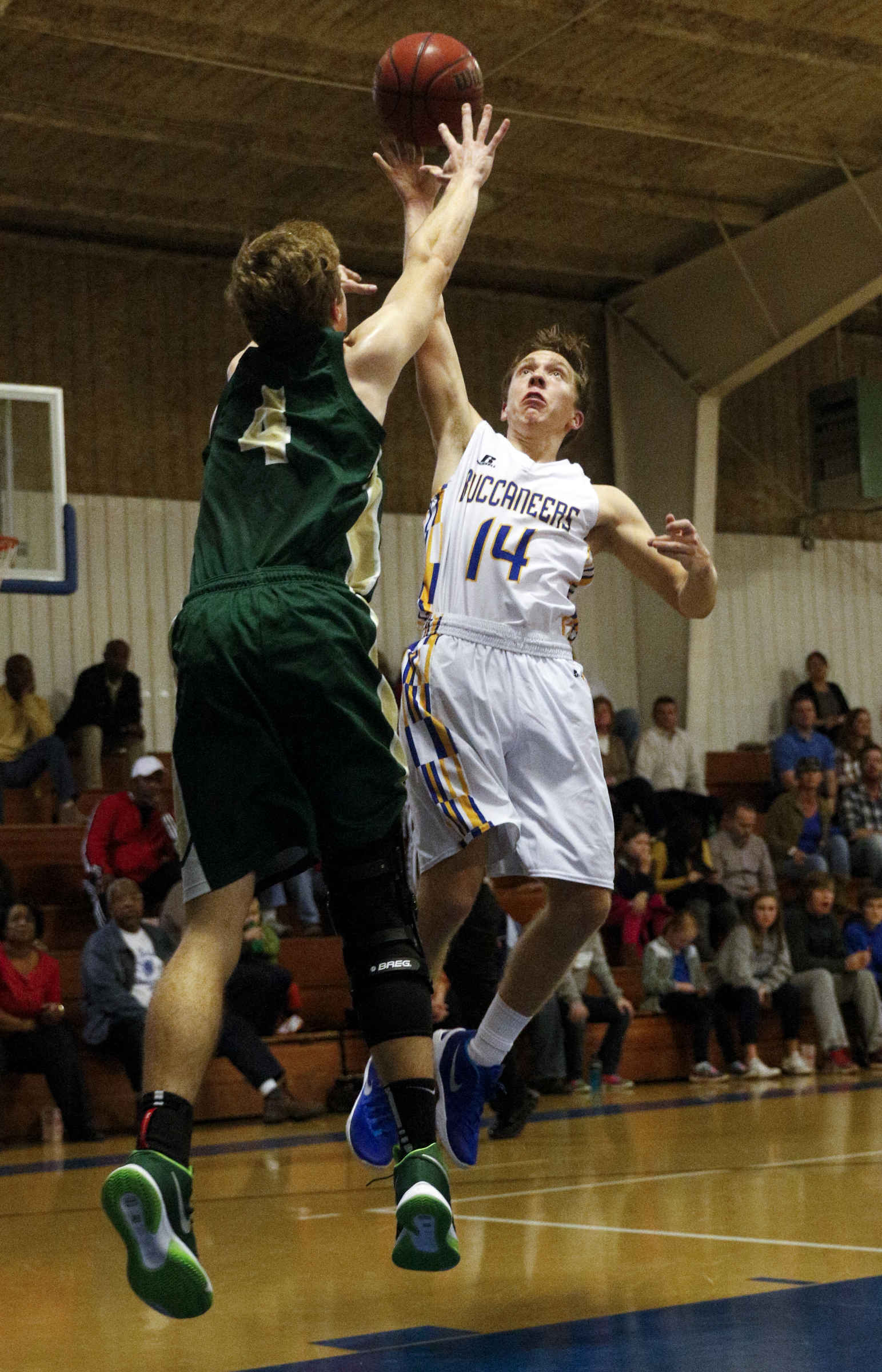 Boyd-Buchanan's Adam Mullinax, right, shoots into Notre Dame's J.R. Davis during their prep basketball game at Boyd-Buchanan High School on Thursday, Nov. 19, 2015, in Chattanooga, Tenn.