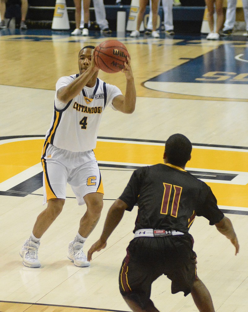 Johnathan Burroughs-Cook pulls up to take a shot as the University of Tennessee at Chattanooga hosts Hiwassee College in a men's basketball game Monday, Nov. 16, 2015, in Chattanooga, Tenn. UTC won their home opener by a score of 94-55.