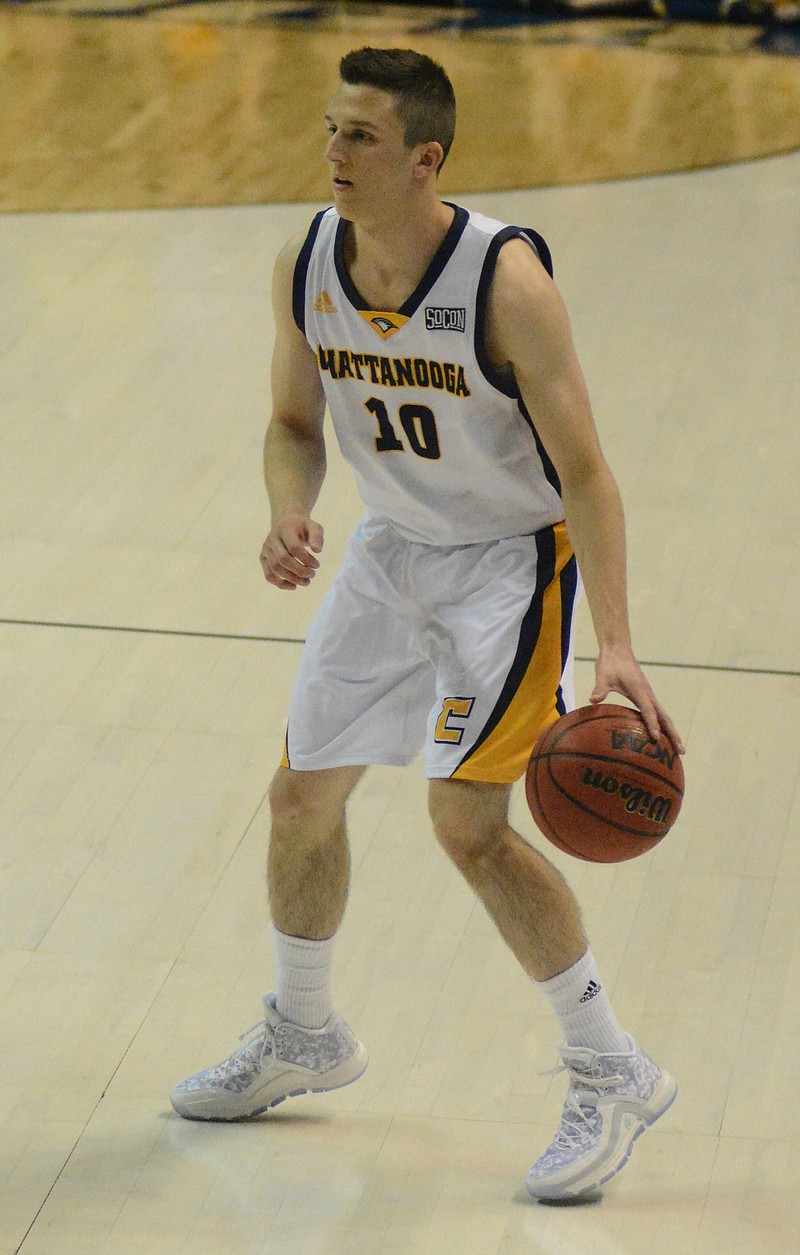 Peyton Woods dribbles the ball as the University of Tennessee at Chattanooga hosts Hiwassee College in a men's basketball game Monday, Nov. 16, 2015, in Chattanooga, Tenn. UTC won their home opener by a score of 94-55.