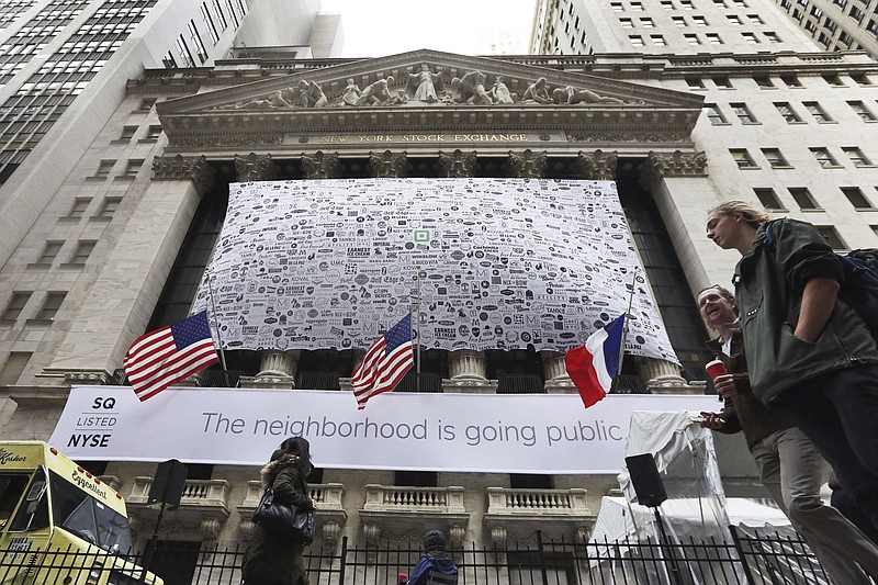 
              The facade of the New York Stock Exchange is decorated for the Square IPO, Thursday, Nov. 19, 2015. Mobile payments processor Square had to sell its stock at a deep discount to complete its initial public offering, a concession signaling that investors are becoming wary of once-hot startups that haven't proven they can make money. (AP Photo/Richard Drew)
            