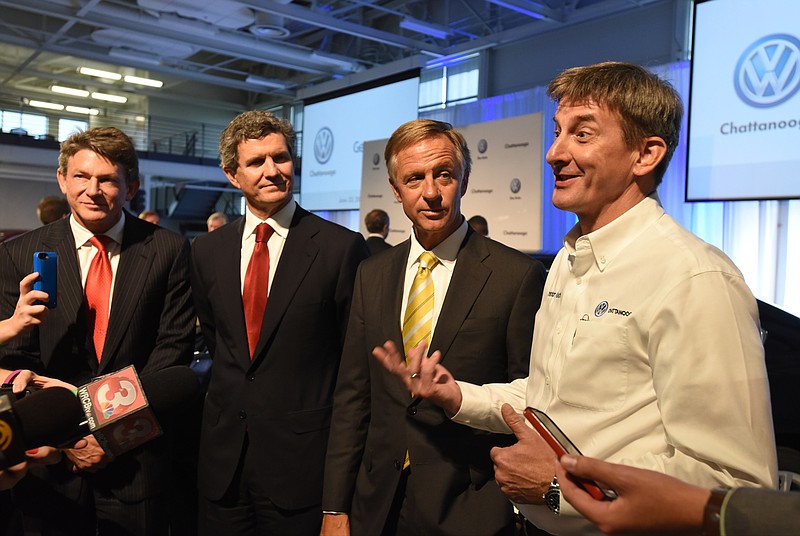 Economic Development Commissioner Randy Boyd, President and CEO of Gestamp, Francisco J. Riberas, and Governor Bill Haslam, from left, listen as President and CEO of Volkswagen Chattanooga, Christian Koch, right, speaks with the press after a press conference Tuesday, June 23, 2015, at Volkswagen Group of America to announce the creation of more than 500 new jobs through a partnership between Volkswagen and Gestamp. The project will include expanding Gestamp's existing Chattanooga facility, and constructing a new sampling facility in Enterprise South.