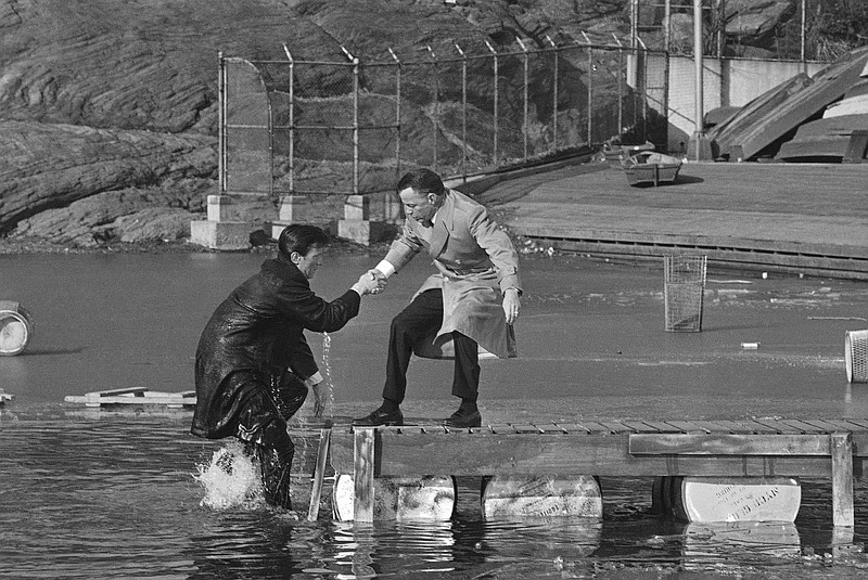 Frank Sinatra helps Laurence Harvey from the lake at Central Park in New York in February during the filming of "The Manchurian Candidate." Harvey, who plays a brainwashed Korean War soldier, has reacted to the random suggestion: "Go jump in the lake."