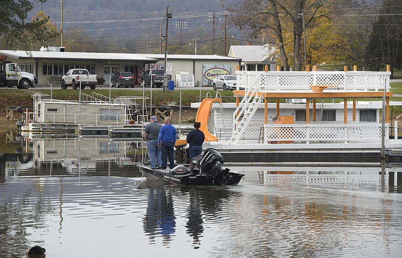 On a fishing trip from Pikeville, Ky., George Prater, Jerry Prater and Kierra Prater, from left, come back to the Dayton Boat Docks after a morning of fishing on Tuesday, Nov. 17, 2015, in Dayton, Tenn. Competitive fishing tournaments have helped the economy in Dayton and Rhea County. 