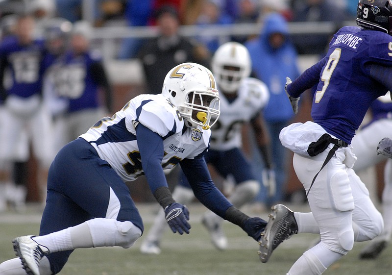 UTC's T.J. Jenkins dives to tackle Western Carolina quaterback Wes Holcombe (9).  The University of Tennessee/Chattanooga Mocs defeated Western Carolina 51-0 at Cullowhee, North Carolina.  This win puts the Mocs in the driver seat for the Southern Conference title.