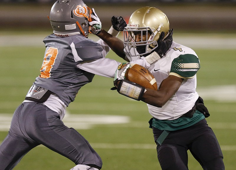 Staff Photo by Dan Henry / The Chattanooga Times Free Press- 11/20/15. Notre Dame's Calvin Sims (4) and East Ridge's Josh Williams (8) both get called for dual facemark violations during Friday's quarterfinal playoff game on November 20, 2015. 