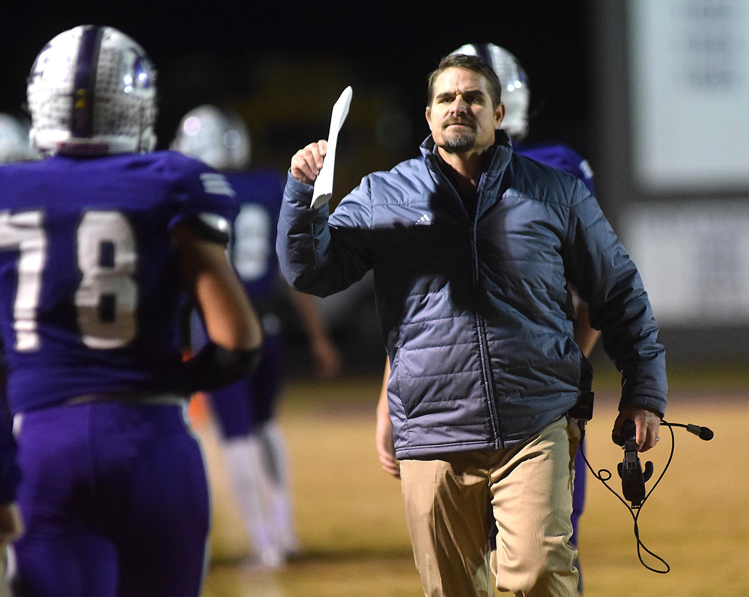 Marion County head coach Ricky Ross congratulates his team after a field goal. The Tyner Rams visited the Marion County Warriors in a quarterfinal game in the TSSAA State Football Playoffs on Friday November 20, 2015.