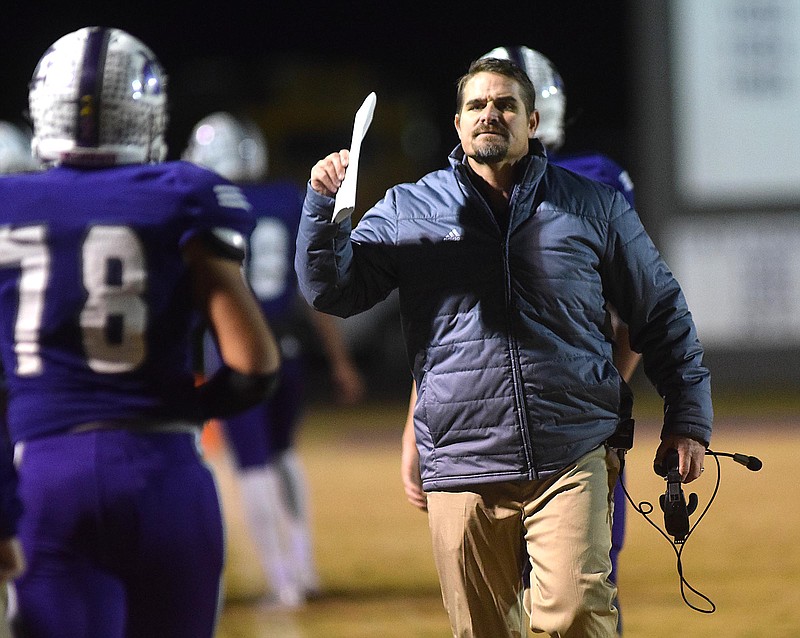 Marion County head coach Ricky Ross congratulates his team after a field goal.  The Tyner Rams visited the Marion County Warriors in a quarterfinal game in the TSSAA State Football Playoffs on Friday November 20, 2015.