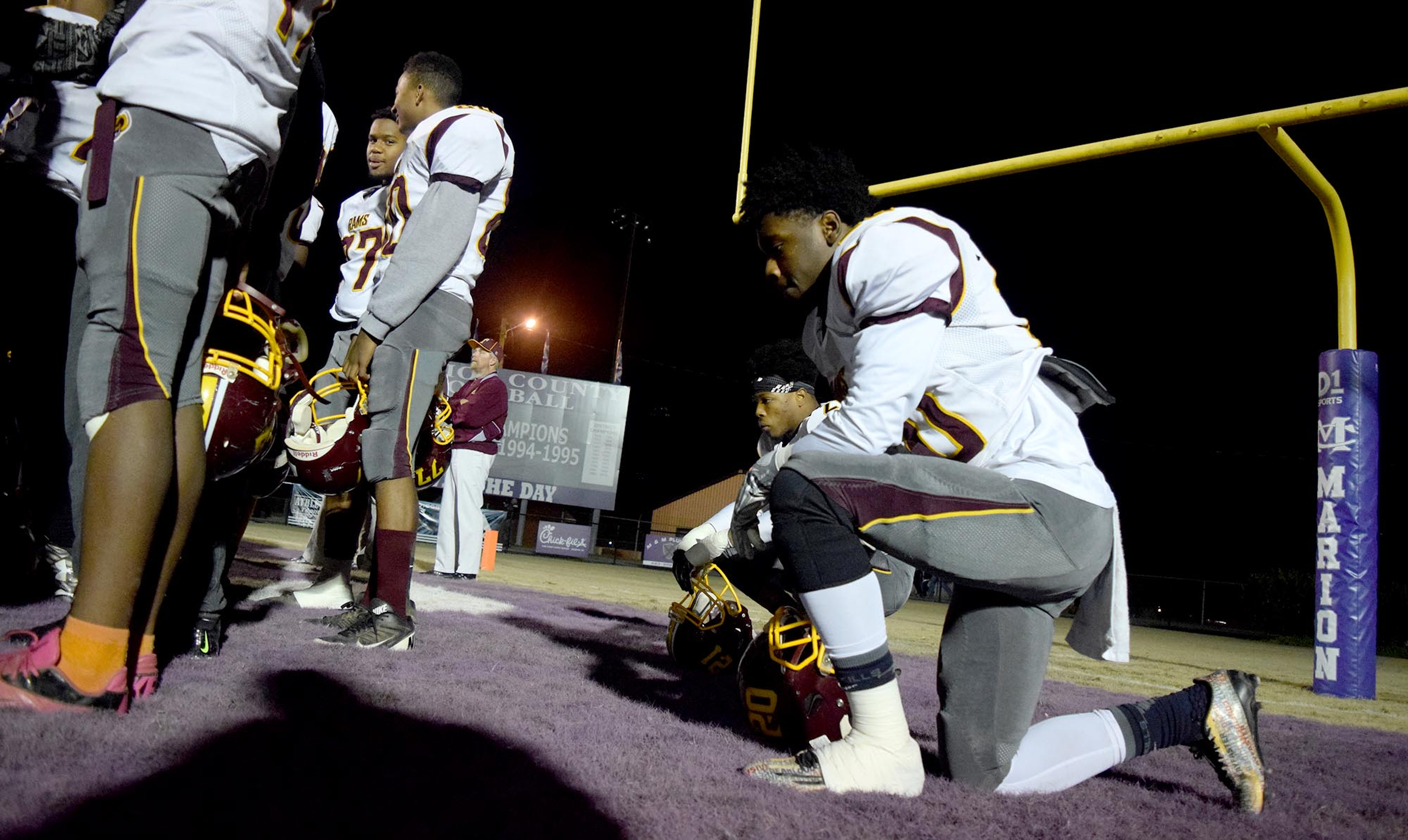 Tyner's Juwan Samuels (20) takes a knee in the endzone before the game. The Tyner Rams visited the Marion County Warriors in a quarterfinal game in the TSSAA State Football Playoffs on Friday November 20, 2015.