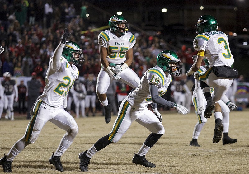 Rhea County players celebrate a turnover during their TSSAA prep football playoff football game against Ooltewah at Ooltewah High School on Friday, Nov. 20, 2015, in Ooltewah, Tenn.