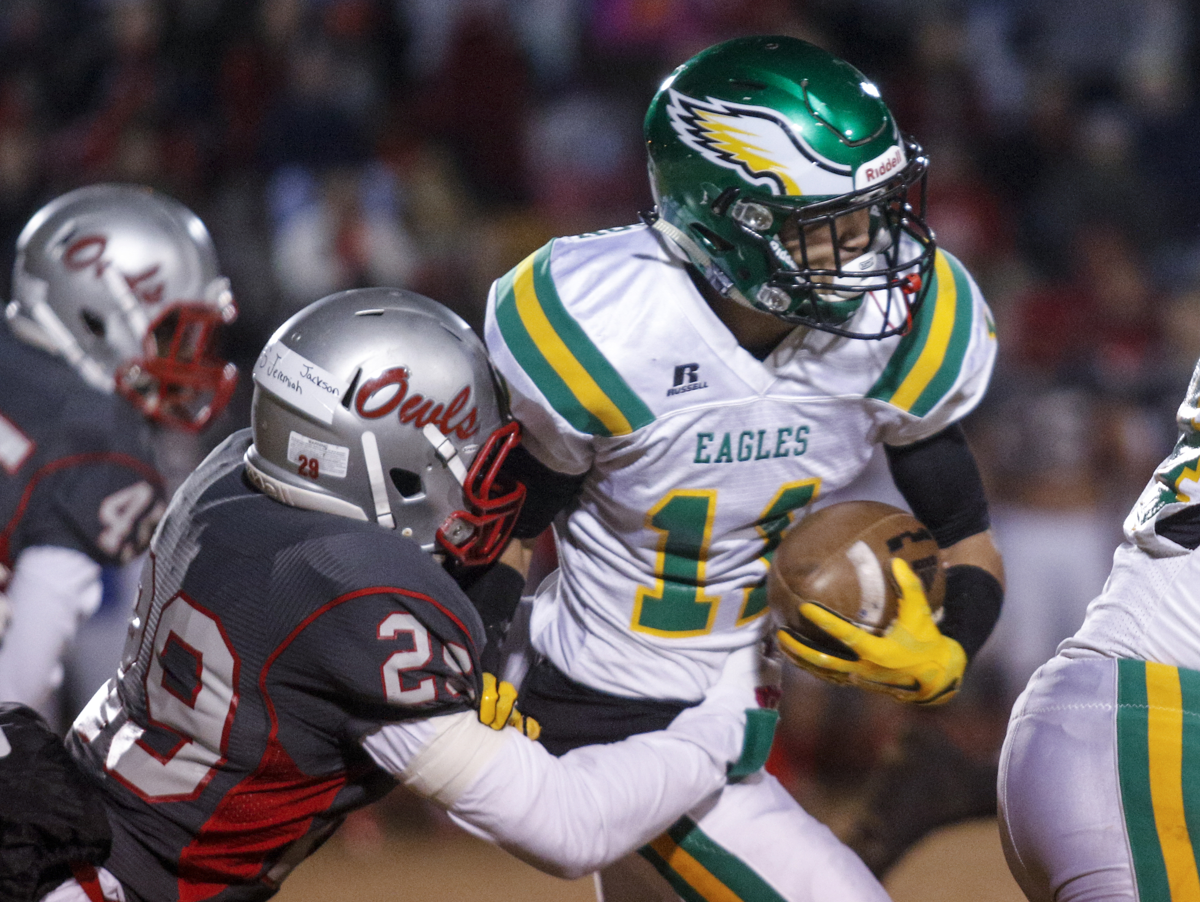 Ooltewah's A.J. Diggs, left, tackles Rhea County's Noel Patterson during their TSSAA prep football playoff football game at Ooltewah High School on Friday, Nov. 20, 2015, in Ooltewah, Tenn.
