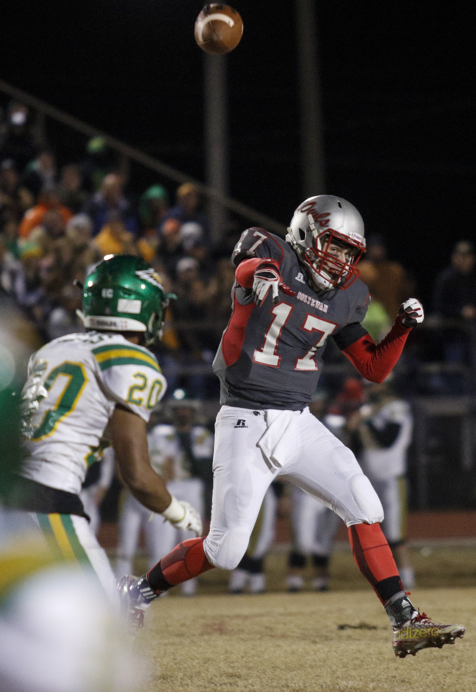 Ooltewah quarterback London Elrod passes under pressure from Rhea County's Eddie Davis during their TSSAA prep football playoff football game at Ooltewah High School on Friday, Nov. 20, 2015, in Ooltewah, Tenn.