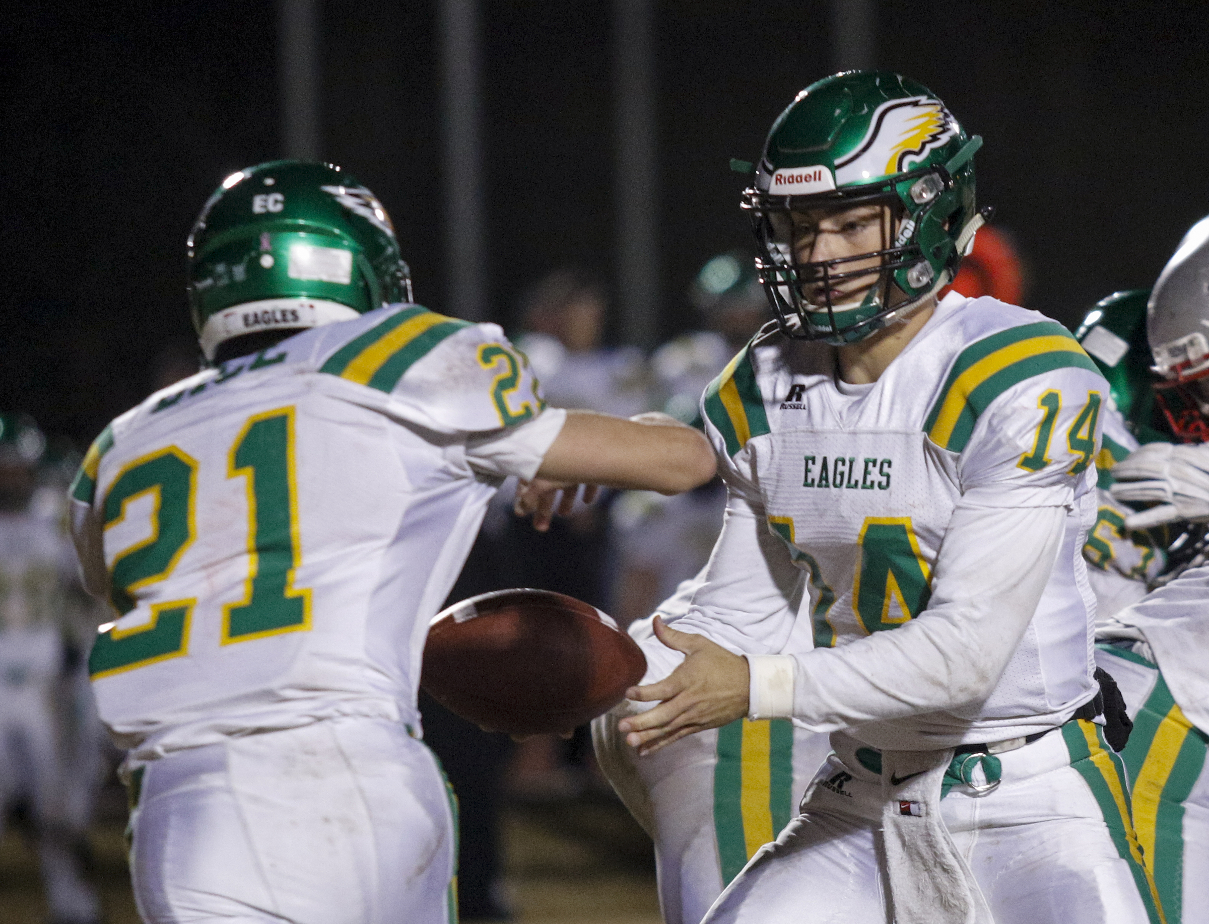 Rhea County quarterback Daniel Dotson hands off to Cody Bice during their TSSAA prep football playoff football game at Ooltewah High School on Friday, Nov. 20, 2015, in Ooltewah, Tenn.