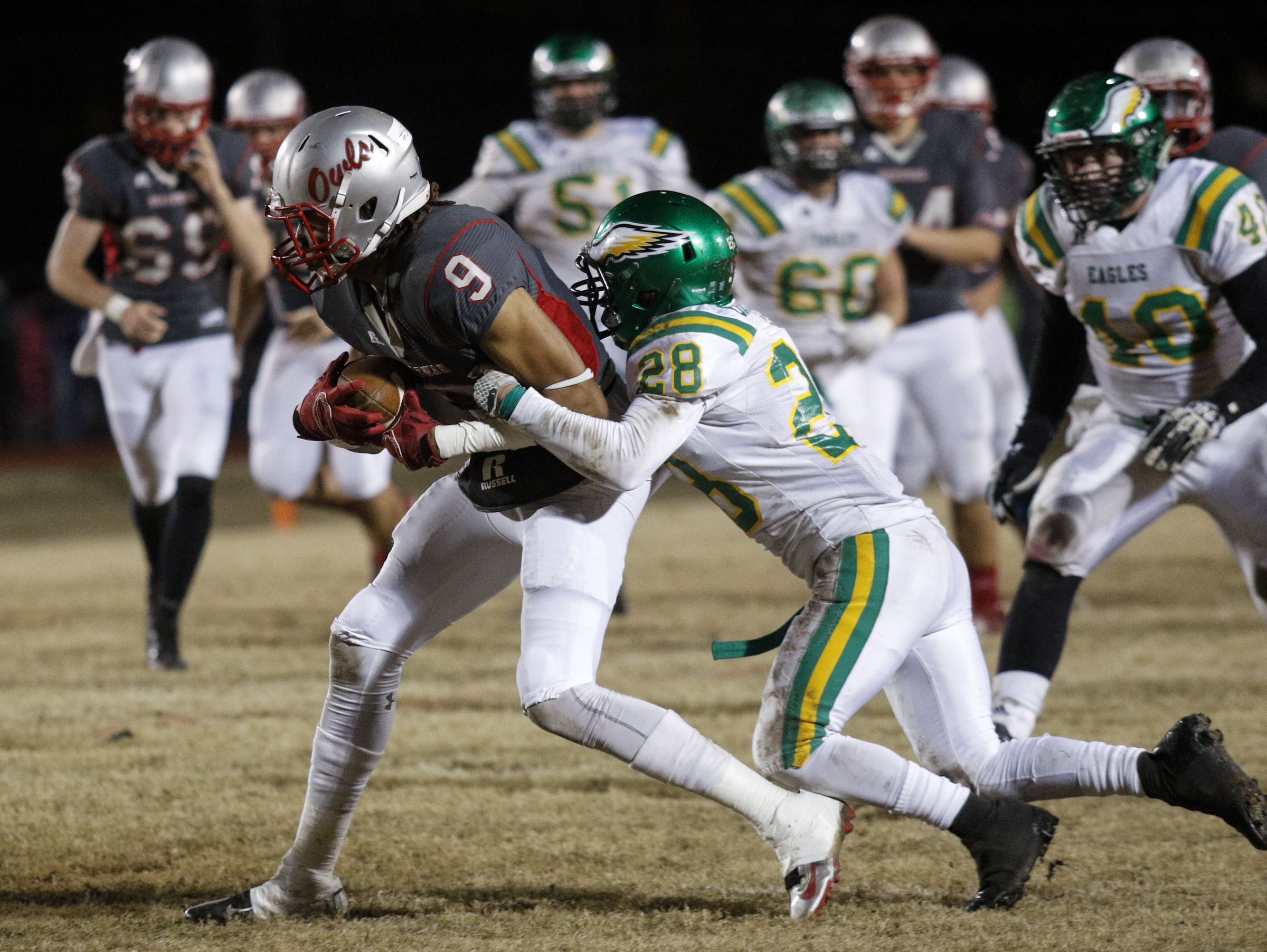 Rhea County's Daniel Ortega tackles Ooltewah's Koby Jones during their TSSAA prep football playoff football game at Ooltewah High School on Friday, Nov. 20, 2015, in Ooltewah, Tenn.