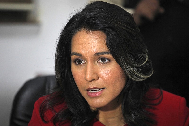 
              FILE - In this Dec. 27, 2014 file photo, Rep. Tulsi Gabbard, D-Hawaii speaks in Ahmadabad, India. In an unusual alliance, Gabbard and Rep. Austin Scott, R-Ga., have teamed up to urge the Obama administration to stop trying to overthrow Syrian President Bashar Assad and focus all its efforts on destroying Islamic State militants. (AP Photo/Ajit Solanki, File)
            