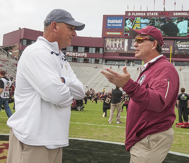 Florida State head coach Jimbo Fisher, right, talks with Chattanooga head coach Russ Huesman prior to the start of an NCAA college football game in Tallahassee, Fla., Saturday, Nov. 21, 2015. (AP Photo/Mark Wallheiser)