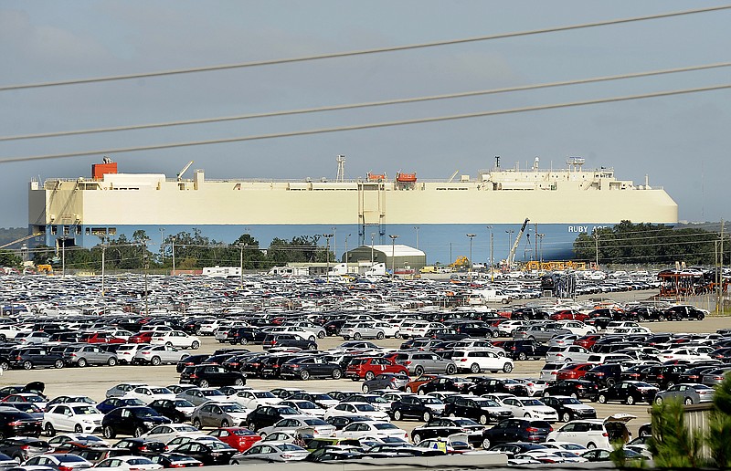 In this Oct. 20, 2015 photo, new automobiles being shipped through the Port of Brunswick sit in a vast parking lot at the Colonels Island terminal in Brunswick, Ga. Despite losing business this year from an automaker lured to neighboring Florida, the Georgia Ports Authority has approved $12.7 million to expand its storage space for new cars and trucks. In recent years Brunswick has become one of the nations busiest seaports for vehicle imports and exports, and Georgia port officials say theyre confident that growth will continue. (Bobby Haven/The Brunswick News via AP)