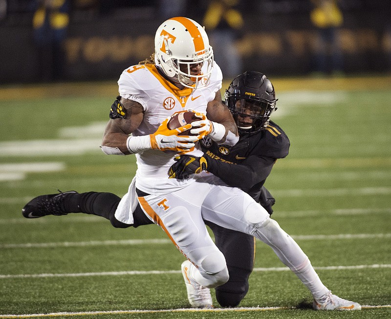 Tennessee wide receiver Von Pearson, left, is tackled by Missouri's Aarion Penton during the first half of an NCAA college football game Saturday, Nov. 21, 2015, in Columbia, Mo. (AP Photo/L.G. Patterson)