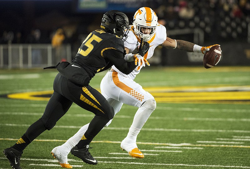 Tennessee running back Jalen Hurd, right, is wrapped up by Missouri's Donavin Newsom, left, during the third quarter of an NCAA college football game Saturday, Nov. 21, 2015, in Columbia, Mo. (AP Photo/L.G. Patterson)