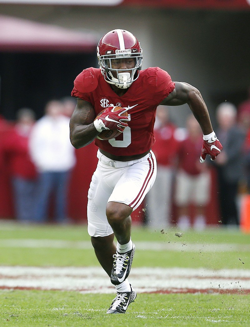 
              Alabama defensive back Cyrus Jones (5) returns a punt for a touchdown during the first half of an NCAA football game against Charleston Southern, Saturday, Nov. 21, 2015, in Tuscaloosa, Ala. (AP Photo/Butch Dill)
            