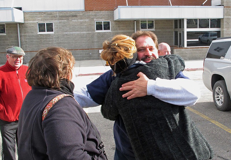 
              Barry Beach hugs a reporter as he departs Montana State Prison in Deer Lodge, Mont., Friday, Nov. 20, 2015. Gov. Steve Bullock commuted Beach's sentence to time served with 10 years suspended. Beach was serving a 100-year sentence with no possibility of parole for the 1979 beating death of a 17-year-old schoolmate. (AP Photo/Matt Volz)
            