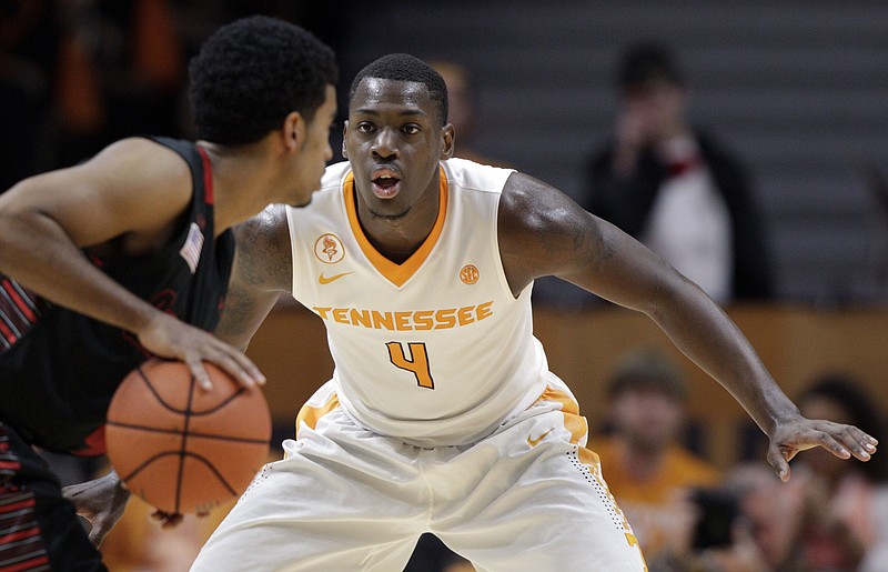  Tennessee forward Armani Moore (4) defends during an NCAA college basketball game against Gardner-Webb on Sunday, Nov. 22, 2015. (Wade Payne/Knoxville News Sentinel via AP)
