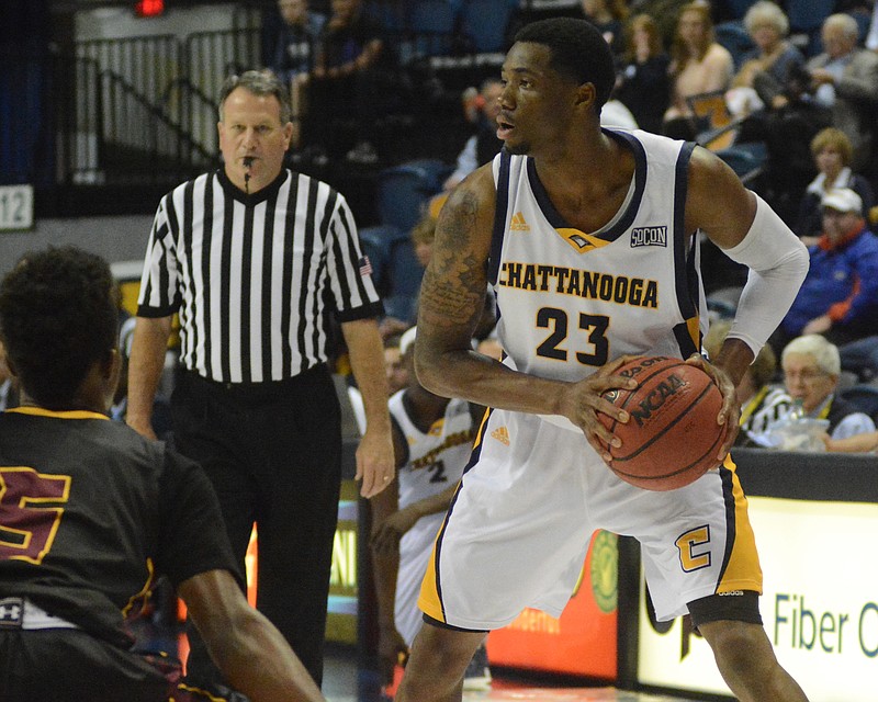 Tre' McLean looks to pass as the University of Tennessee at Chattanooga hosts Hiwassee College in a men's basketball game Monday, Nov. 16, 2015, in Chattanooga, Tenn. UTC won their home opener by a score of 94-55.