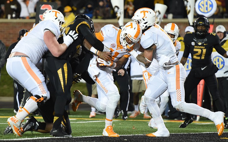 Tennessee quarterback Joshua Dobbs runs for a touchdown during the first half of Saturday's win at Missouri.