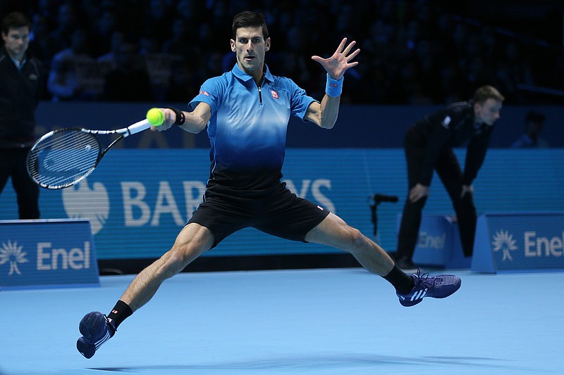 
              Novak Djokovic of Serbia plays a return to Roger Federer of Switzerland during their ATP World Tour Finals final tennis match at the O2 Arena in London, Sunday Nov. 22, 2015. (AP Photo/Tim Ireland)
            