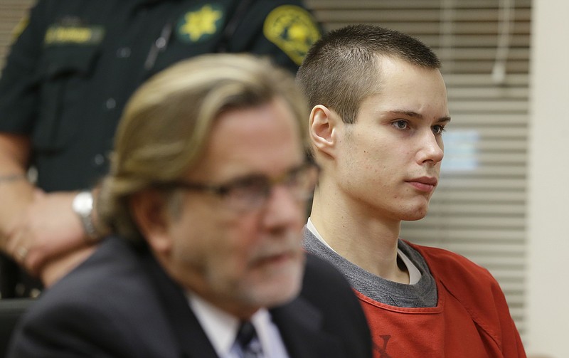 
              FILE - In a Wednesday, May 8, 2013, file photo, Colton Harris-Moore, right, who is also known as the "Barefoot Bandit," sits in a Skagit County Superior Courtroom, in Mount Vernon, Wash., next to his attorney, John Henry Browne, left.  Hollywood studio 20th Century Fox has paid more than $1 million to settle the “Barefoot Bandit’s” court-ordered restitution in exchange for the rights to his story. The studio wrote a check to the U.S. Marshal’s office earlier in November 2015. The money mostly paid for three small airplanes he stole and crash landed and a boat he hijacked in the Bahamas while evading capture. (AP Photo/Ted S. Warren, File)
            