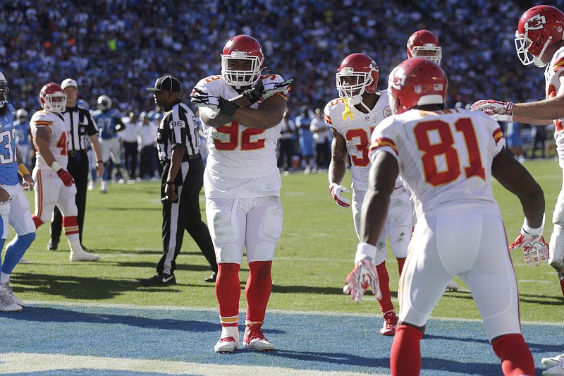 The Kansas City Chiefs' Dontari Poe, cenrter, celebrates his touchdown during the first half of an NFL football game against the San Diego Chargers on Sunday, Nov. 22, 2015, in San Diego.